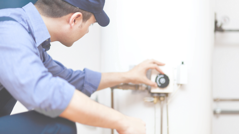 worker-repairing-water-heater-quicker-rooter-emergency-plumbing-calgary